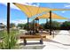 Community playground features a covered play structure, a bench, and a sand ground covering at 2425 E Beverly Rd, Phoenix, AZ 85042