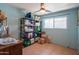 Bedroom with light blue walls and tan tile floors, lots of room to store your belongings at 2534 N Mitchell St. St, Phoenix, AZ 85006
