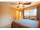 Bedroom with plush bedding, ceiling fan, and lots of natural light at 2534 N Mitchell St. St, Phoenix, AZ 85006