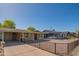 Charming single-story home with a well-maintained front yard, a fenced yard, and a covered carport at 2534 N Mitchell St. St, Phoenix, AZ 85006