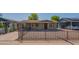 Charming brick home with a well-maintained front yard and gravel landscaping, complemented by a secure metal fence at 2534 N Mitchell St. St, Phoenix, AZ 85006