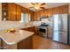 Updated kitchen with stainless steel appliances, ample counter space, and wooden cabinets for a modern cooking experience at 2534 N Mitchell St. St, Phoenix, AZ 85006