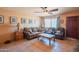 Inviting living room with a ceiling fan, tile flooring, and a cozy seating arrangement perfect for relaxation at 2534 N Mitchell St. St, Phoenix, AZ 85006
