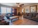 Spacious living room showcasing tile floors, comfortable seating, and a view into the adjacent dining area at 2534 N Mitchell St. St, Phoenix, AZ 85006