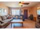 Relaxing living room featuring tile floors, cozy sofas, and a ceiling fan, providing a comfortable atmosphere at 2534 N Mitchell St. St, Phoenix, AZ 85006