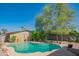 Backyard pool surrounded by mature trees, offering a private and serene outdoor space at 2534 N Mitchell St. St, Phoenix, AZ 85006