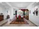 Elegant dining room featuring a chandelier, area rug, and wooden furniture, perfect for entertaining at 30224 N 52Nd Pl, Cave Creek, AZ 85331