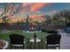 Outdoor fire pit lounge area with comfortable chairs for relaxing evenings at 30224 N 52Nd Pl, Cave Creek, AZ 85331