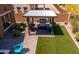Outdoor BBQ area with pergola, grill, and a well-maintained backyard space at 30876 N 128Th Dr, Peoria, AZ 85383