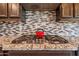 Modern kitchen features stainless steel appliances, gas range and a stylish backsplash at 30876 N 128Th Dr, Peoria, AZ 85383