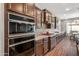 Modern kitchen featuring built-in stainless appliances, granite countertops, and lots of cabinet storage at 30876 N 128Th Dr, Peoria, AZ 85383