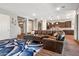 Open-concept living space showcasing kitchen and comfortable seating at 30876 N 128Th Dr, Peoria, AZ 85383