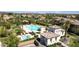 Beautiful community pool with lounge chairs, gazebo, lush landscaping, and a separate pool at 30876 N 128Th Dr, Peoria, AZ 85383