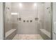 Large tile shower with dual shower heads and seating at 30876 N 128Th Dr, Peoria, AZ 85383
