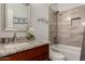 Beautiful bathroom features a granite countertop, tiled shower, and modern fixtures at 3793 E Lexington Ave, Gilbert, AZ 85234