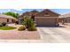 Charming single-story home with a well-maintained desert landscaped front yard and a two-car garage at 3793 E Lexington Ave, Gilbert, AZ 85234