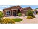 Single-story home with desert landscaping, manicured lawn, and a welcoming front entrance at 3793 E Lexington Ave, Gilbert, AZ 85234