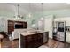 Open floor plan featuring kitchen with island, stainless appliances, and granite countertops at 3793 E Lexington Ave, Gilbert, AZ 85234