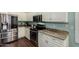 Close-up of kitchen featuring stainless steel appliances, granite countertops, and ample cabinet space at 3793 E Lexington Ave, Gilbert, AZ 85234