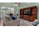 Open living area with sleek media center, comfortable seating, and sliding glass door at 3793 E Lexington Ave, Gilbert, AZ 85234