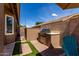 Backyard outdoor kitchen area with built-in BBQ and counter space, perfect for grilling and entertaining at 3793 E Lexington Ave, Gilbert, AZ 85234