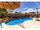 Backyard with a sparkling pool, patio area and a charming pergola perfect for outdoor entertaining and relaxation at 3793 E Lexington Ave, Gilbert, AZ 85234