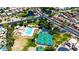 Aerial view showcases community pool, tennis courts, ponds, and lush landscaping for recreation and relaxation at 3854 E Cathedral Rock Dr, Phoenix, AZ 85044