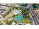 An aerial view showcasing community pool and tennis courts as well as ponds and greenery at 3854 E Cathedral Rock Dr, Phoenix, AZ 85044