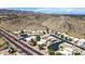 Aerial view of a well-planned community nestled against a stunning mountain backdrop at 3854 E Cathedral Rock Dr, Phoenix, AZ 85044