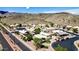 Scenic aerial view of residential properties in a desert community, featuring a long road at 3854 E Cathedral Rock Dr, Phoenix, AZ 85044