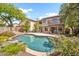 Gorgeous backyard with a sparkling pool, mature trees, and a patio, perfect for relaxation and entertaining at 3854 E Cathedral Rock Dr, Phoenix, AZ 85044
