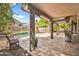 Stunning backyard boasts a covered patio, pool, outdoor grill, and beautifully landscaped area at 3854 E Cathedral Rock Dr, Phoenix, AZ 85044