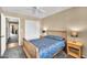 Comfortable bedroom showcases a wooden bed with a blue floral cover and light colored nightstands at 3854 E Cathedral Rock Dr, Phoenix, AZ 85044