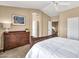 Bedroom with a large dresser and access to multiple rooms at 3854 E Cathedral Rock Dr, Phoenix, AZ 85044