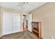 Cozy bedroom featuring a ceiling fan, a closet with white sliding doors, and light brown carpet at 3854 E Cathedral Rock Dr, Phoenix, AZ 85044