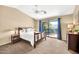 Cozy bedroom with a sliding glass door and a lovely backyard view at 3854 E Cathedral Rock Dr, Phoenix, AZ 85044