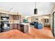 Spacious open concept kitchen with stainless steel appliances and a seamless flow to the living area at 3854 E Cathedral Rock Dr, Phoenix, AZ 85044