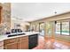 Bright open kitchen features stainless steel appliances, white countertops, and access to the backyard at 3854 E Cathedral Rock Dr, Phoenix, AZ 85044