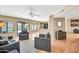 Open concept living area features tiled floors and views of the sparkling backyard pool at 3854 E Cathedral Rock Dr, Phoenix, AZ 85044