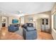 Comfortable living room offers blue seating, natural light and terracotta tile flooring at 3854 E Cathedral Rock Dr, Phoenix, AZ 85044