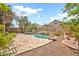 Private backyard showcasing a beautiful pool with rock features and a stone tile patio perfect for outdoor relaxation at 3854 E Cathedral Rock Dr, Phoenix, AZ 85044