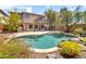 Resort-style pool surrounded by lush landscaping, a patio, and a charming upper balcony overlooking the water at 3854 E Cathedral Rock Dr, Phoenix, AZ 85044