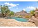 Lovely backyard featuring a pool, patio, water feature, and mature landscaping, providing a private retreat at 3854 E Cathedral Rock Dr, Phoenix, AZ 85044