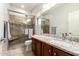 Beautiful bathroom with granite counters and a tiled walk-in shower at 40853 W Bravo Dr, Maricopa, AZ 85138