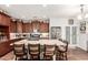 Stylish kitchen with a large granite island, stainless steel appliances, and ample cabinet space at 40853 W Bravo Dr, Maricopa, AZ 85138