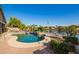 Inviting private pool with lush landscaping and stunning lake views at 40853 W Bravo Dr, Maricopa, AZ 85138