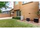 Home exterior features a well-maintained yard with lush grass and an AC unit at 4368 E Cullumber St, Gilbert, AZ 85234