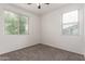 Bright and airy bedroom with two large windows providing plenty of natural light and outdoor views at 4368 E Cullumber St, Gilbert, AZ 85234