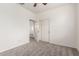Clean bedroom with plush carpet features neutral tones, fan, and convenient closet at 4368 E Cullumber St, Gilbert, AZ 85234