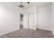 Neutral carpeted bedroom with double door closet and ensuite access offers serene comfort at 4368 E Cullumber St, Gilbert, AZ 85234